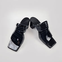 Strappy leather heeled sandals in black color